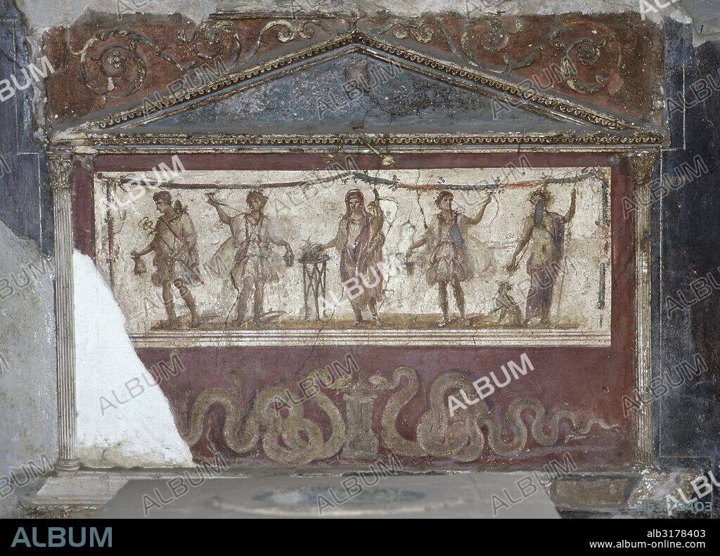 Pompeii. Lararium of the Thermopolium of Asellina. For a domestic cult. Frescoes depicting the Genius of the Pater Family among Lares (protective gods) making offerings. At his feet, the great serpent Agathodaimon. La Campania. Italy.