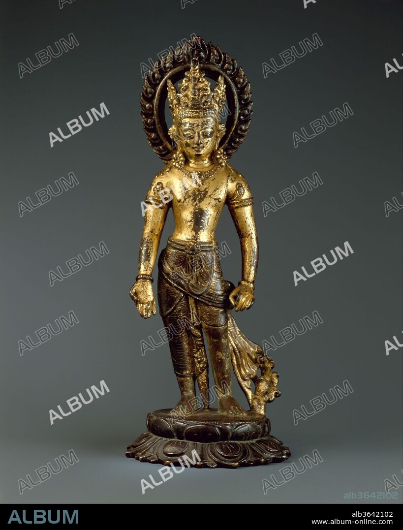 Avalokiteshvara, the Bodhisattva of Infinite Compassion. Culture: Nepal (Kathmandu Valley). Dimensions: H. 12 in. (30.5 cm); W. 4 3/4 in. (12.1 cm); D. 4 5/8 in. (11.7 cm); Wt. 5 lbs (2.3 kg). Date: 10th century.
The embodiment of Buddhist compassion grants boons to devotees with his extended hand. He wears a spectacular tripartite diadem, jewelry, and a low-slung sash with fluted folds that extend to the ground. Stylistically, this image represents a continuation of conventions developed in the late Lichhavi era (8th-9th century).