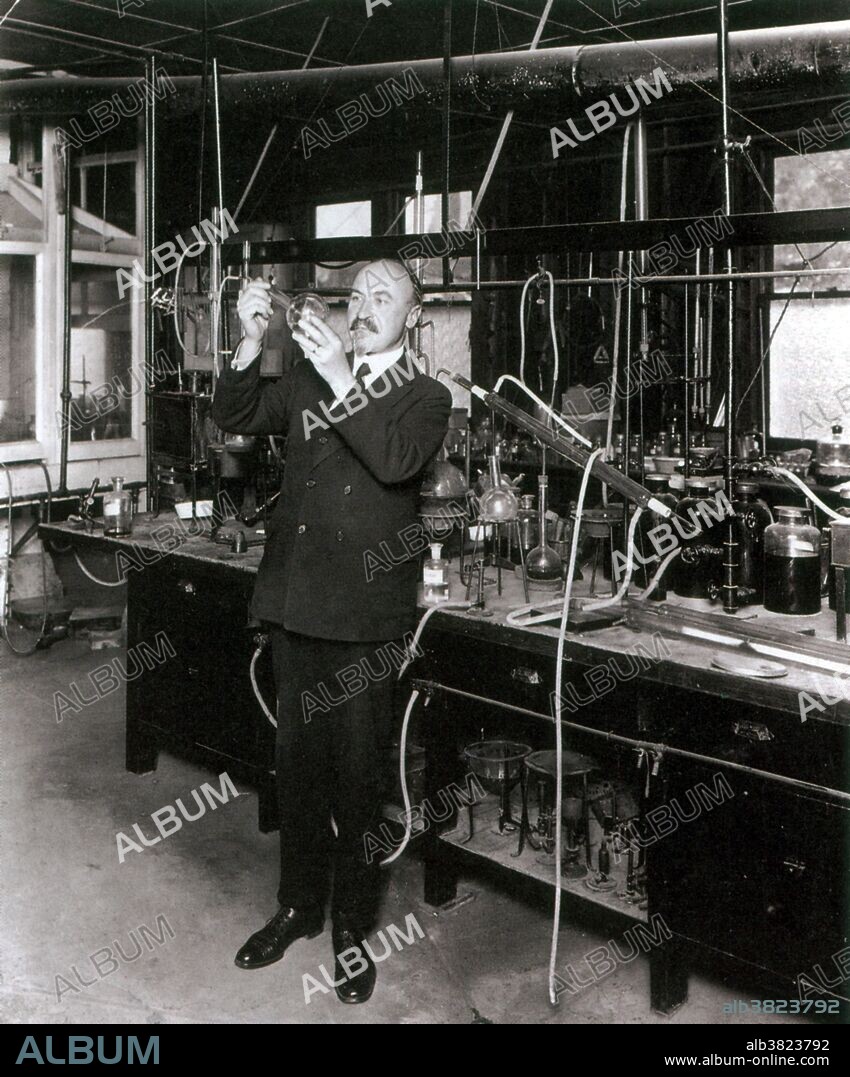 Baekeland in his laboratory. Leo Henricus Arthur Baekeland (November 14, 1863 - February 23, 1944) was a Belgian-American chemist. In 1889 while honeymooning in NYC, he met Richard Anthony, part owner of a photographic company. Baekeland had already invented a process to develop photographic plates using water instead of other chemicals; Anthony saw potential in the young chemist and offered him a job. In 1893 he perfected the process to produce a photographic paper that would allow enlargements to be printed by artificial light, which he named Velox. By controlling the pressure and temperature applied to phenol and formaldehyde, he invented Bakelite (polyoxybenzylmethylenglycolanhydride). His process patent for making insoluble products of phenol and formaldehyde was filed in July 1907, and granted on December 7, 1909. His invention of Bakelite, an inexpensive, nonflammable, versatile, and popular plastic, marked the beginning of the modern plastics industry. He sold the General Bakelite Company to Union Carbide in 1939 and, at his son's prompting, he retired. He died in 1944, at the age of 80, of a cerebral hemorrhage. No photographer credited, undated.