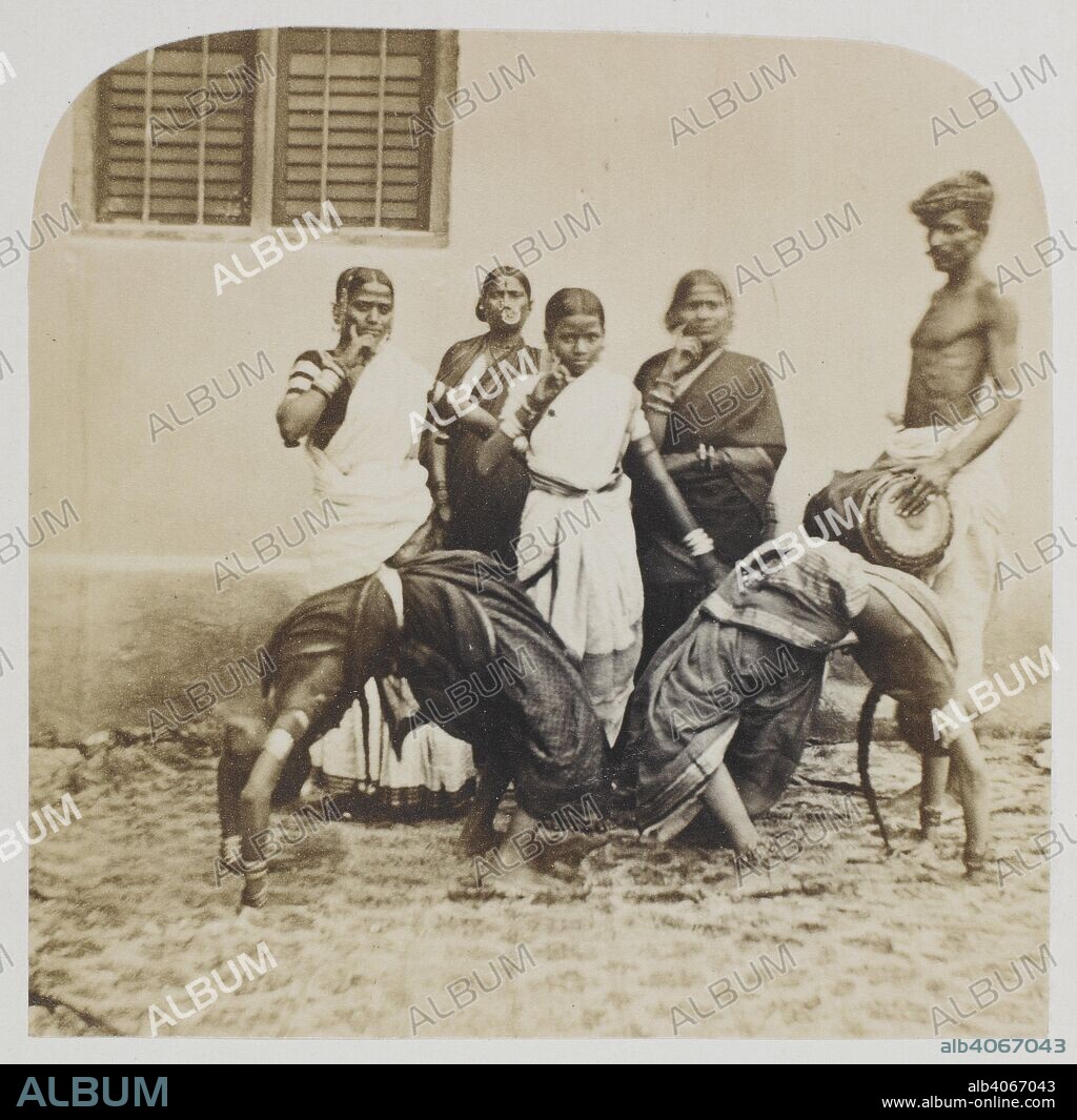 Hindoo dancing girls, probably at Secunderabad. A group standing with a  drummer, and two girls bent over backwards with their hands touching the  ground behind them. Capta - Album alb4067043