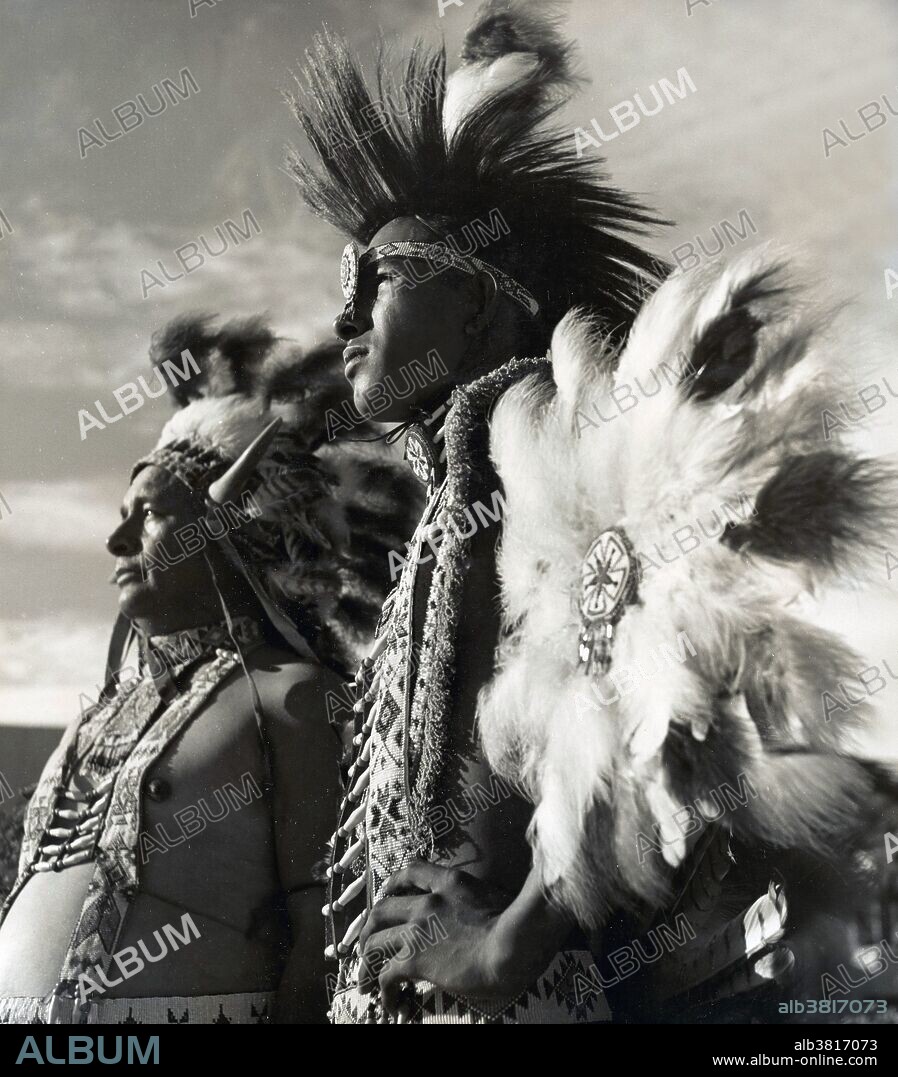 Two Native American men, father and son, in traditional Navaho dress, photographed in Phoenix, Arizona, in June, 1953.