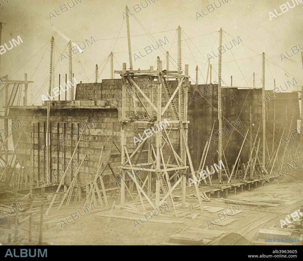 The 'Great Eastern' under construction, Millwall, London, 1855. Albumen print. Isambard Kingdom Brunel's steamship 'Great Eastern', built between 1854 and 1858, was by far the largest ship of her time with a gross tonnage of 18,915. Designed to carry up to 4000 passengers between England, the Far East and Australia without refuelling, Great Eastern was the first ship to have a double-skinned hull. The construction of the vessel at Millwall attracted huge public interest, and it was famously photographed by Robert Howlett as well as by Joseph Cundall. Despite acute financial difficulties, and failed launches in November 1857, Great Eastern was eventually launched in January 1858.