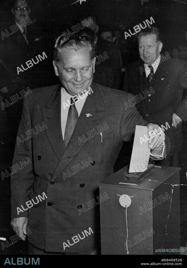 Marshal Tito, Yugoslav Chief of State, drops his paper into the box during the Yugoslav Communist Party's New Central Committee.The Ballot was held November 7 last day of the party congress in Zagreb.Behind Tito, is Miho Marinko, premier of the Slovenian Republican Government.November 13, 1952. (Photo by Associated Press Photo).