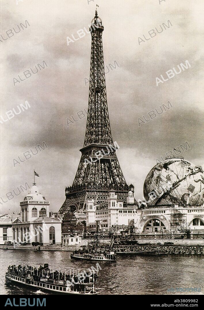 The Exposition Universelle of 1900 was a world's fair held in Paris, France, to celebrate the achievements of the past century and to accelerate development into the next. The Eiffel Tower in middle from right bank of the Seine. Forestry Building and the globe from Point Passay. The Eiffel Tower built in 1889, it has become both a global icon of France and one of the most recognizable structures in the world. Named for its designer, engineer Gustave Eiffel, the tower was built as the entrance arch to the 1889 World's Fair.