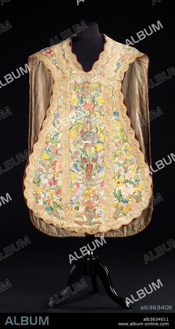 Chasuble. Culture: probably Portuguese. Dimensions: Length at CB: 41 in. (104.1 cm). Date: late 18th century.
The extensive appliqué work almost completely covers the substrate of the chasuble. A great deal of attention was paid to creating the lively color combination; the lavish use of primary colors lends a certain naive quality. The gleaming braid, with its serpentine scallop, adds to the overall decorative appearance.