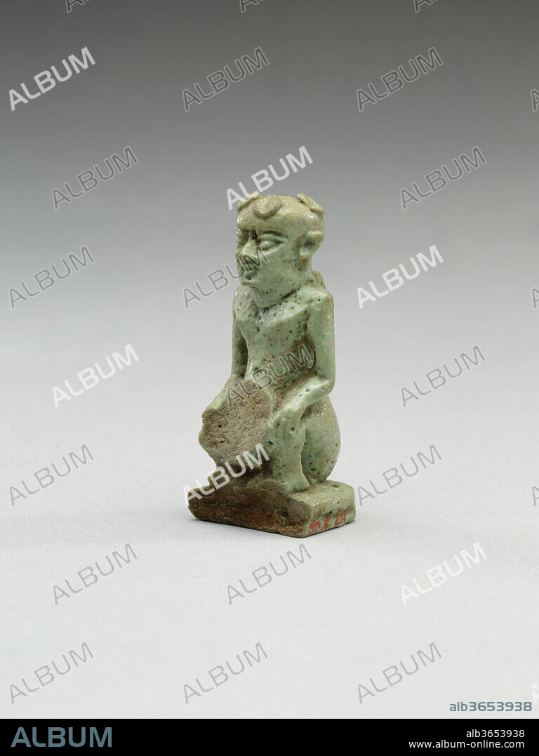 Nude crouching figure wearing a wreath, large phallus broken away. Dimensions: H. 4.7 × W. 1.9 × D. 1.8 cm (1 7/8 × 3/4 × 11/16 in.). Date: 664-30 B.C..
The small figure wearing a leafy crown crouches with his knees raised on either side of a large broken away area; the broken element was an oversized phallus based on traces and many parallels. The identity of the figure is unclear, but is likely connected with the complex of informal statuary including many ithyphallic figures in the Late and Ptolemaic Periods. In general these informal figurines are thought to be connected with festivals celebrating a divine birth.