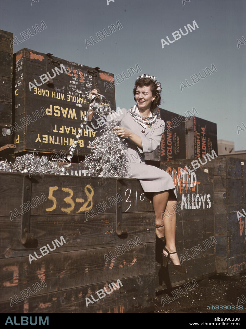 ALFRED T PALMER. Annette del Sur publicizing salvage campaign in yard of Douglas Aircraft Company, Long Beach, Calif.