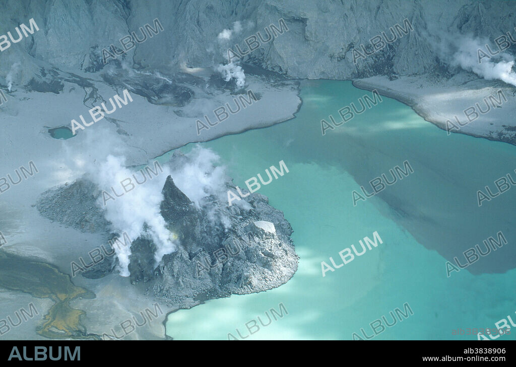 Growing dome in lake inside the Mount Pinatubo caldera, Luzon Island, Philippines. Note also the growing spine on the dome, and the nearby cinder cones. March 8, 1993.