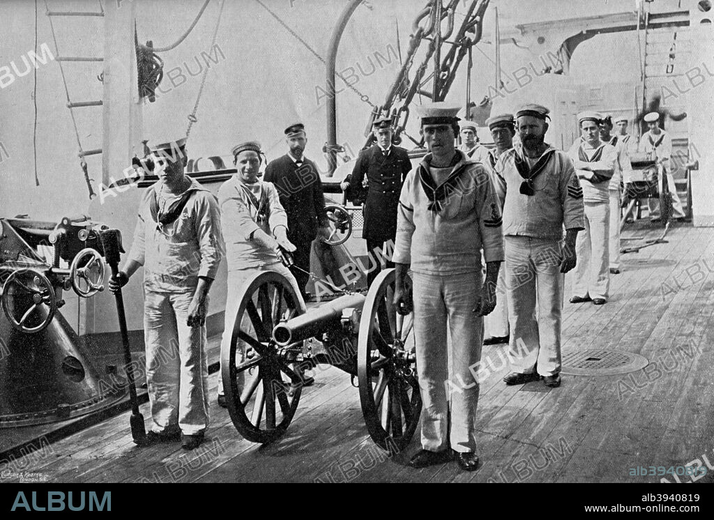 Drill with a light gun on board HMS 'Camperdown', 1895. HMS 'Camperdown' was an Admiral class battleship launched in 1885. A print from The Navy and Army Illustrated, 20th December 1895.