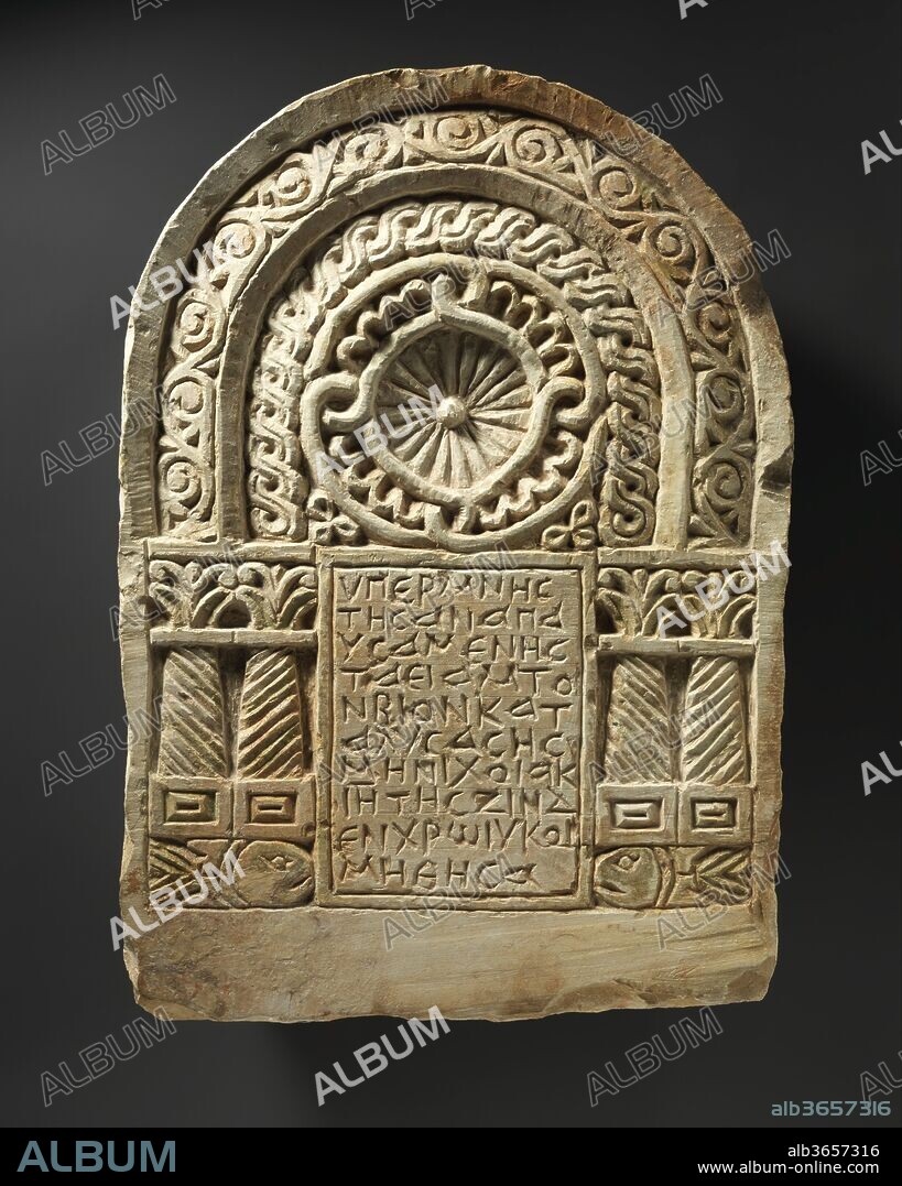 Funerary Stele with Architectural Frame. Dimensions: H. 20 11/16 in. (52.5 cm)
W. 14 9/16 in. (37 cm). Date: 6th-7th century.
Funerary stelae from the Byzantine period in Egypt, carved in stone and usually painted, were permanent monuments to the deceased. While normally embedded in walls or floors near the tomb, some were part of larger structures. Their decorations include scenes of paradise and symbols of the Christian Church. This example, said to be from the Upper Nile Delta town of Armant, bears the name of a prominent citizen who was buried near the marker.