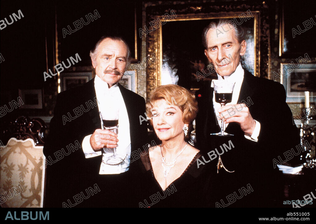 ANNE BAXTER, JOHN MILLS and PETER CUSHING in SHERLOCK HOLMES AND THE MASKS OF DEATH, 1984 (THE MASKS OF DEATH), directed by ROY WARD BAKER. Copyright LORIMAR PRODUCTIONS.