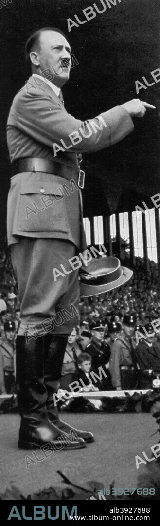 Adolf Hitler at the Nuremberg Rally, Germany, 1935. Hitler (1889-1945) at the seventh Nazi Party Congress. A print from Adolf Hitler. Bilder aus dem Leben des Führers, Hamburg: Cigaretten/Bilderdienst Hamburg/Bahrenfeld, 1936.