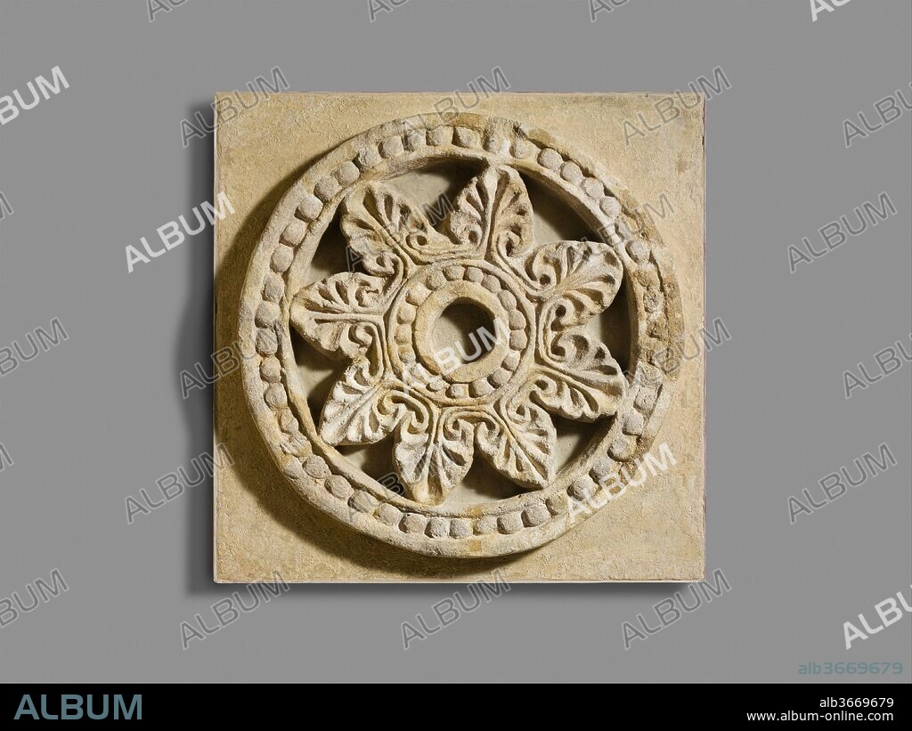 Roundel with radiating palmettes. Culture: Sasanian. Dimensions: 24 1/2 in., 80 lb. (62.2 cm). Date: ca. 6th century A.D..
When this wheel-shaped window was excavated at the site of Ma'aridh II in the Ctesiphon area, it was in pieces, indicating that it fell from a height. It is decorated on only one side, with palmettes forming spokes that connect an inner and an outer ring of beads. Based on round windows found at contemporary monuments in Syria, the decorated side of the window may have faced outward. The occurrence of such windows at Ctesiphon provides evidence of the exchange of artistic ideas between Mesopotamia and the eastern Mediterranean.
The city of Ctesiphon was located on the east bank of the Tigris River, 20 miles (32 km) south of modern Baghdad in Iraq. It flourished for more than 800 years as the capital of the Parthians and the Sasanians, the last two dynasties to rule the ancient Near East before the Islamic conquest in the seventh century. Systematic excavations in the Ctesiphon area were undertaken by an expedition in 1928-29 sponsored by the German Oriental Society (Deutsche Orient-Gesellschaft). The Metropolitan Museum of Art and the Staatliche Museen, Berlin, undertook a joint expedition for one season in 1931-32. Several excavations were conducted, including at the main palace (Taq-i Kisra), in a small fortified area south of the palace at Tell Dheheb, at multiple houses at the mounds of Ma'aridh, and at additional houses at a small mound called Umm ez-Za'tir.
Over the course of the excavations in the Ctesiphon area, six houses from a series of small mounds called el Ma'aridh were excavated. These houses follow typical Sasanian design with a mix of square and elongated rooms. Ma'aridh II is a large house that is entered through a small entry way rather than directly from the street. The house is divided into a utilitarian, or service, sector on the eastern side of the building, and a monumental decorated space to the west of the entryway. The western rooms were decorated with pillars, a double horseshoe archway, and stucco reliefs. A long barrel vaulted arched room, 19 meters in length, was probably the most important room of the house. It was entered through a smaller room with four pillars. This large house, with the excavated portion revealing more than 1800 square meters, represents an elite household.
Excavation Number: O.1404.