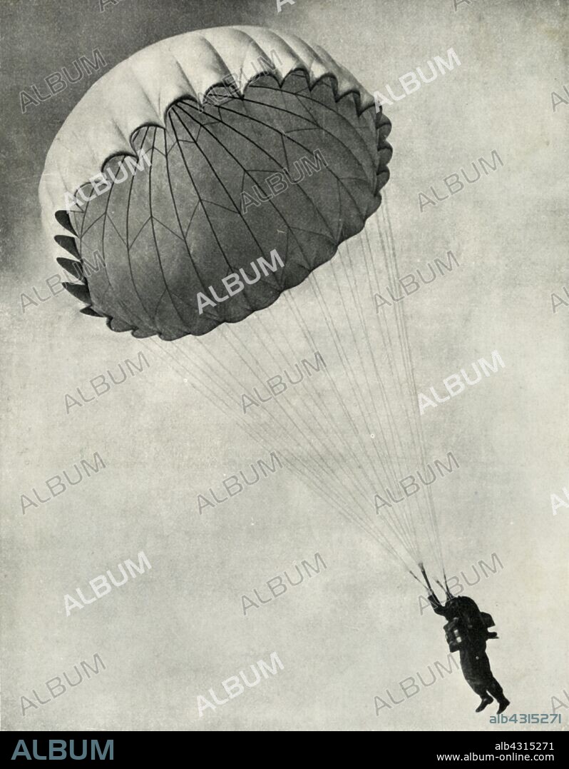 CHARLES BROWN. Airman using a parachute during the Second World War, 1941. 'The "free" parachute type is standardised in the R.A.F., and with it parachutist jumps with the pack attached.' From "The Royal Air Force in Pictures", 2nd edition, by World War I flying ace Major Oliver Stewart. [Country Life Ltd, London, 1941].