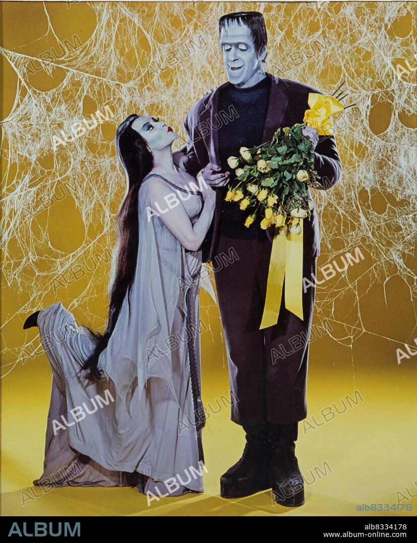 FRED GWYNNE and YVONNE DE CARLO in THE MUNSTERS, 1964, directed by EARL BELLAMY, EZRA STONE, GENE REYNOLDS, JERRY PARIS, JOSEPH PEVNEY and NORMAN ABBOTT. Copyright CBS/MCA/UNIVERSAL.