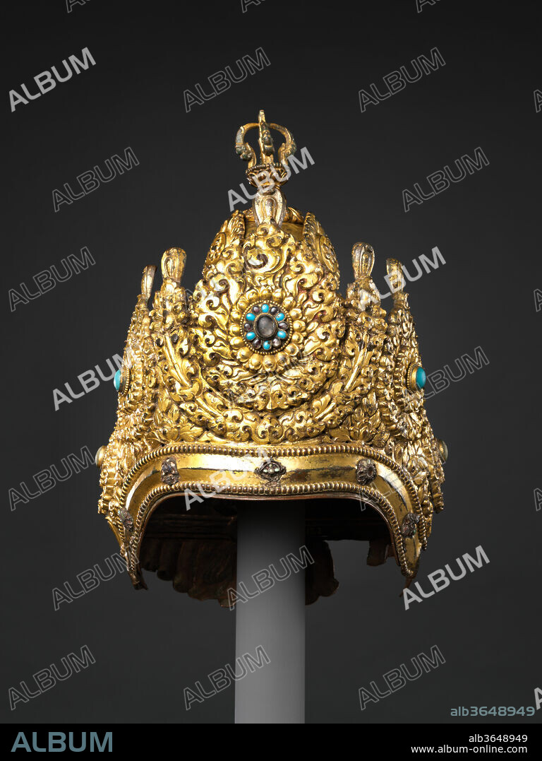 Vajracharya Priest's Crown. Culture: Nepal. Dimensions: H. 12 in. (30.5 cm); W. 7 1/2 in. (19.1 cm); D. 6 3/4 in. (17.1 cm). Date: dated 1717.
Elaborate crowns such as this example were worn by the hereditary Vajracarya Buddhist priests of Nepal, who occupy the highest rank in the Nepalese Buddhist community. Vajracarya is both a caste and a family name, and the designation entitles it holders to perform reserved priestly functions, analogous to the privileges held by Brahmans in Hinduism. This crown is dominated by five diadem plaques and surmounted by a half-vajra. The dated inscription records that it was commissioned by two named devotees, to be worn on the occasion of the consecration of newly installed icons of Chakrasamvara and Heruka. The consecrations were performed by sri Bekhasi deva Vajracarya of Naka Bahica of OBaha, "on Thursday, the 10th of the dark half of Bhadra, during the Pusya naksatra and the Siddha yoga" (1717). The inscription concludes by listing the punishments incurred by those who covet the crown as well as the merits earned by its donors, extolling: "[May it be] auspicious for all time.".