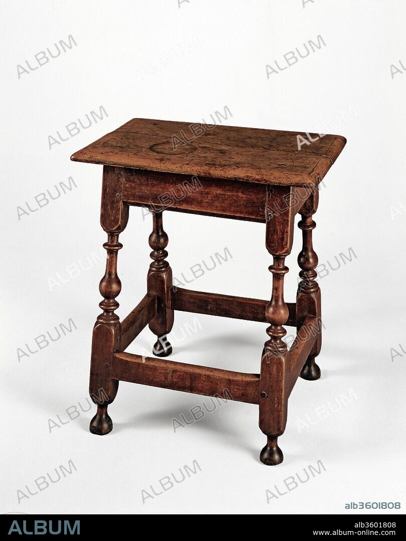 Joint stool. Culture: American. Dimensions: 22 1/2 x 20 1/2 x 14 in. (57.2 x 52.1 x 35.6 cm). Date: 1700-1725.
Joint stools provided basic everyday seating in seventeenth- and early-eighteenth-century households.  The vitality of the baluster turnings on this stool make it an outstanding example of the William and Mary style.  Its high seat made it convenient for a sitter to rest his or her feet on the stretcher of the table it was pulled up to for dining.