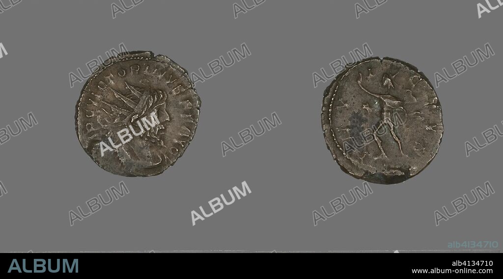 ANCIENT ROMAN. Coin Portraying Emperor Victorian I. Roman. Date: 265 AD-267 AD. Dimensions: Diam. 2.1 cm; 2.99 g. Bronze. Origin: Roman Empire.