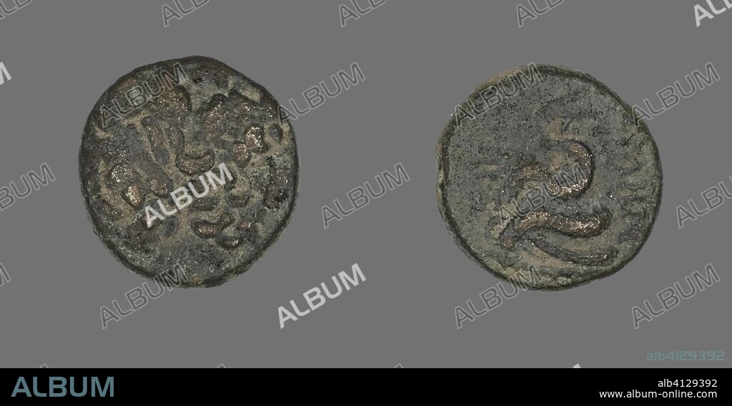 ANCIENT GREEK. Coin Depicting the God Asklepios (?). Greek. Date: 200 BC-133 BC. Dimensions: Diam. 1.9 cm; 7.37 g. Bronze. Origin: Ancient Greece.