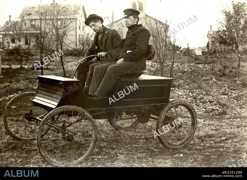 United States: c. 1903 John and Arthur Hull in the first car made by the Hull Brothers.