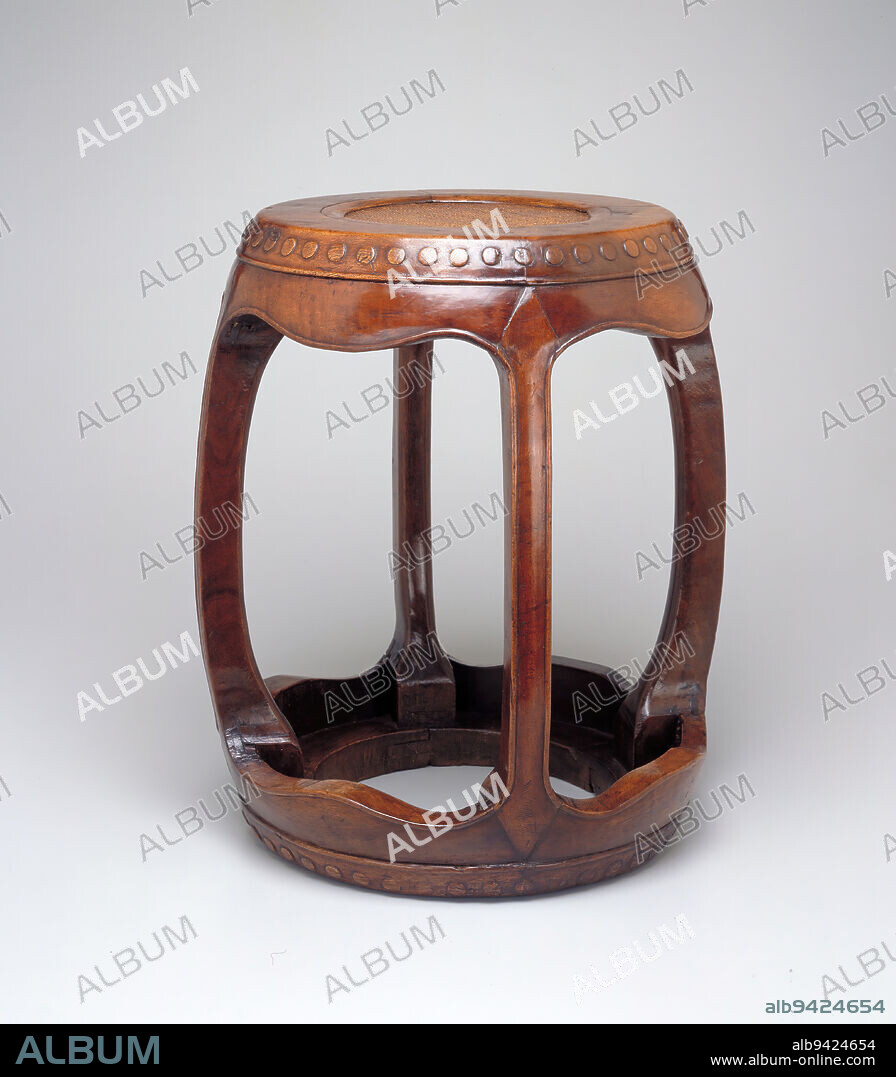 Drum stool, 18th century, 18 3/16 x 16 in. (46.2 x 40.64 cm), Walnut, China, 18th century, A scarcity of huang-hua-li hardwood had set in by the early Ch'ing dynasty and craftsmen turned to more abundant local hardwoods such as walnut. Though softer than huang-hua-li, walnut had a fine grain and could be waxed to a mellow luster. A pleasing shape, this barrel-form stool incorporates four legs into its light framework. Most Chinese stools of this type will use four, five, or six legs. The fewer the number of legs, the less expensive to produce.