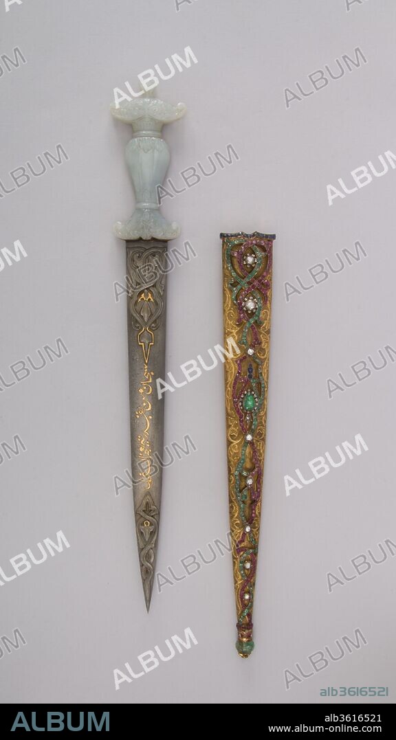 Dagger with Sheath. Culture: Turkish. Dimensions: L. with sheath 17 9/16 in. (44.6 cm); L. without sheath 15 15/16in. (40.5 cm); L. of blade 11 3/16 in. (28.4 cm); W. 2 5/16 in. (5.9 cm); D. 3/4 in. (1.9 cm); Wt. 9.7 oz. (275 g); Wt. of sheath 5.3 oz (150.3 g). Date: 19th century.
This dagger belongs to a large group of flamboyant gem-studded weapons that were probably made in Istanbul in the waning years of the Ottoman Empire. Their traditional shapes and luxurious materials were intended to evoke romantic notions of the exotic orient, <i>Arabian Nights</i>, or perhaps the sultan's treasury. As most of these weapons are found today in American and European collections rather than in Turkish museums, they may have been made exclusively for Western tourists.