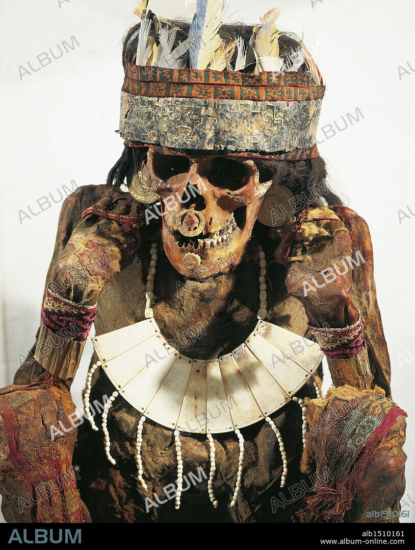 Pre-Inca civilization, Peru, 3rd century b.C. Paracas culture. Mummy of a woman of the Necropolis decorated with gold and bone jewels and a feather headdress, circa 200 b.C.