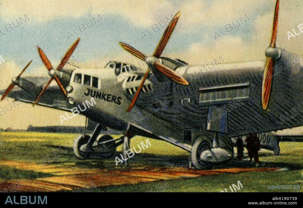 Junkers G.38 plane, 1920s, (1932). The G.38 was a German four-engined transport aircraft which flew commercially in Europe before World War II. It was the largest land plane in the world at the time, and had a unique 'flying wing' design, with passengers sitting in the wings enjoying a panoramic view. From "Die Eroberung Der Luft", (The Conquest of the Air), cigarette card album produced by the Garbáty cigarette factory, 1932. Eugene and Moritz Garbáty, who were Jewish, were driven out of business by the Nazis in the late 1930s, and forced to sell their factory which lay empty for over 70 years. [Garbaty Cigarettenfabrik, Berlin-Pankow, 1932].