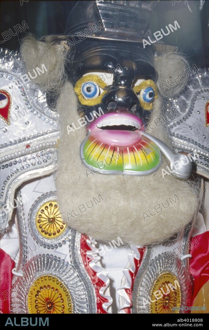 Oruro Mask, Bolivia. Mask from the Oruro region of Bolivia. La Diablada or Oruro Diablada is a typical Andean masked dance to appease the evil spirits. The slow movements represent the toil of the black slaves who worked the mines, often with little food or water. Their masks have enormous bulging eyes depicting the slaves? inability to breathe at such high altitude.