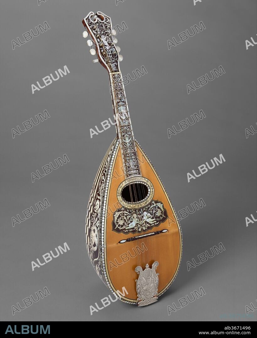 Mandolin. Culture: American. Dimensions: Height: 24 9/16 in. (62.4 cm)
Width: 7 13/16 in. (19.8 cm)
Depth: 5 3/8 in. (13.6 cm). Maker: Angelo Mannello (American, Morcone, Italy 1858-1922 New York). Date: ca. 1900.
Neapolitan style bowlback mandolin with seventeen inlaid nickel-silver frets on a tortoiseshell fingerboard.  The bowl is extraordinarily decorated wiht a rich design of checkerboard pattern ivory and tortoiseshell separated by nickel-silver strips, and a profuse decoration in ivory inlay depicting a naked woman, putti playing instruments, grotesques, and floral designs. These decorative motifs continue on the fingerboard and peghead of the instrument.  The maker's name is inlaid around the oblong soundhole.