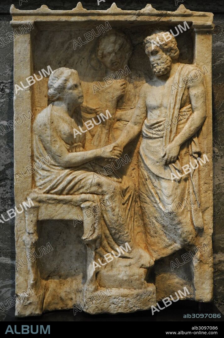 Funerary relief depicting a seated woman, the deceased, takes leave of a man. In the background, perhaps a slave. Scene framed by a building. Probably from Athens. C. 350-300 BC. Marble. Museum of Mediterranean and Near Eastern Antiquities. Stockholm. Sweden.