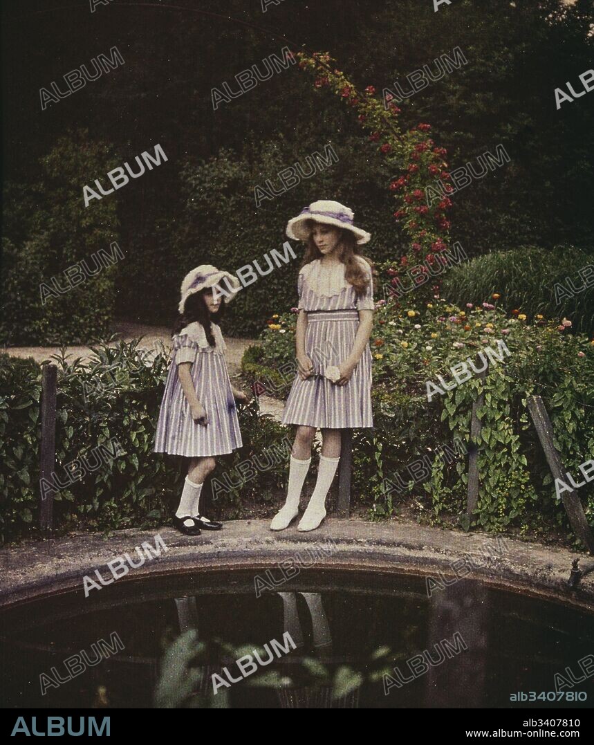 Two girls in a garden, 1908. photographed in Autochrome Lumière, an early colour photography process. Patented in 1903 by the Lumière brothers in France and first marketed in 1907, it was the principal colour photography process in use before the advent of subtractive colour film in the mid-1930s.