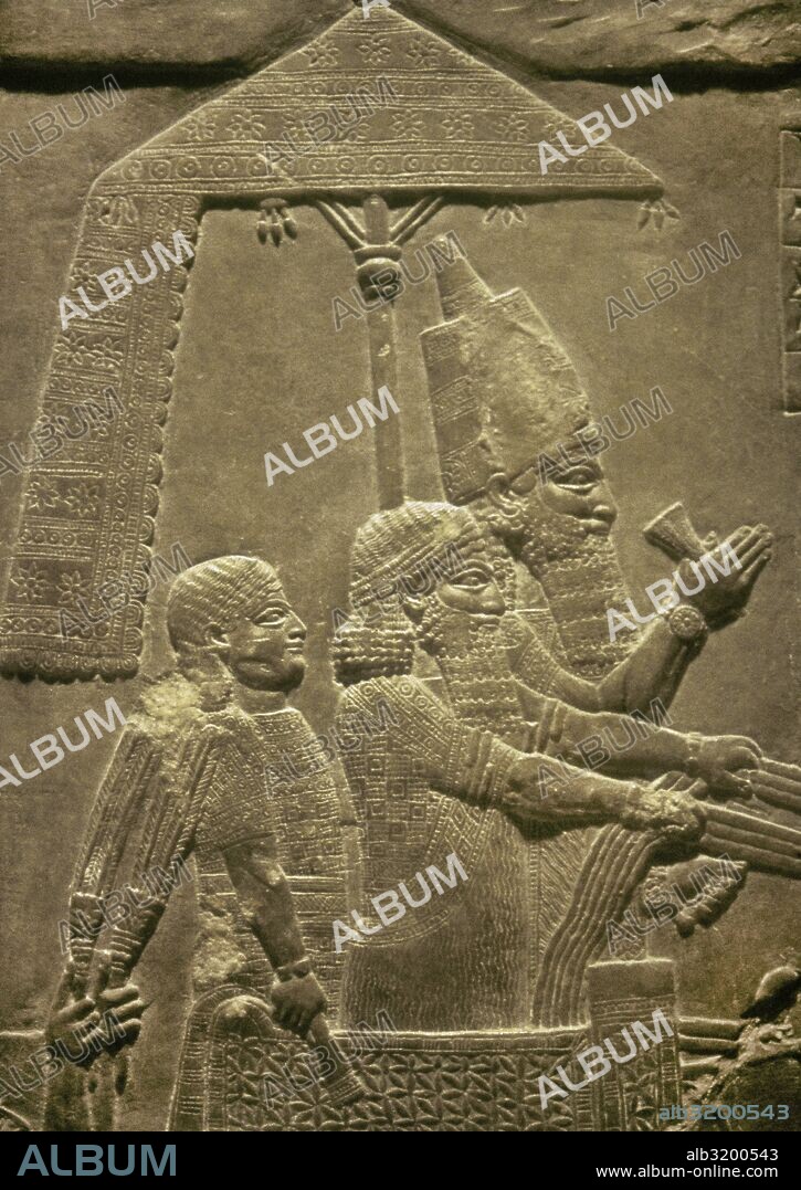 Palace of Ashurbanipal, Nineveh, Iraq. Ashurbanipal with his subjects in his chariot. Relief, detail. Upper Mesopotamia. Neo-Assyrian Empire. 7th century BC. Louvre Museum. Paris, France.