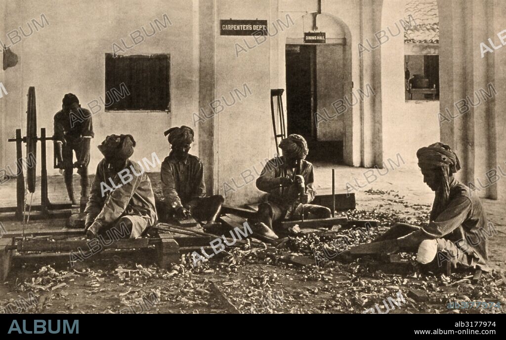 Bombay, India:  June 22, 1919 The loss of limb does not prevent the injured soldiers of India's forces who were disabled in World War I from becoming good carpenters at Queen Mary's Technical School. This was an exhibit of the Red Cross Institute for Crippled and Disabled Men and the Red Cross Institute for the Blind.   © Underwood Archives / The Image Works.