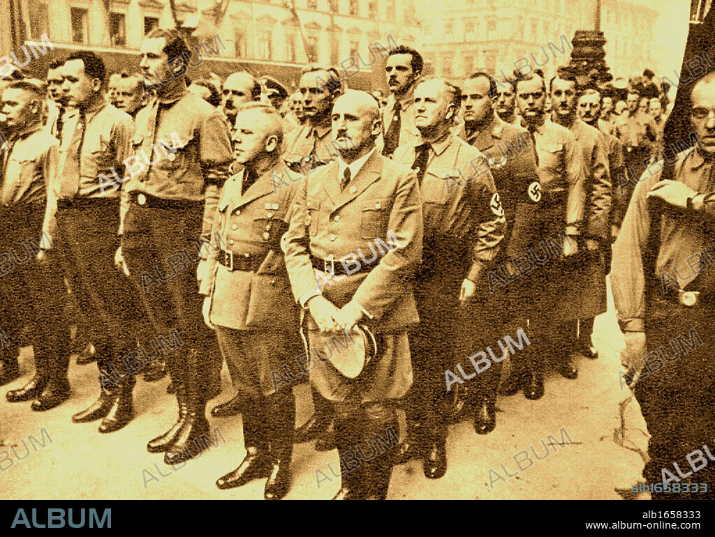 Julius Streicher (1885-1946), centre, prominent Nazi prior to World War II. He was the founder and publisher of the Der Sturmer newspaper, which became a central element of the Nazi propaganda. He was convicted of crimes against humanity and executed.