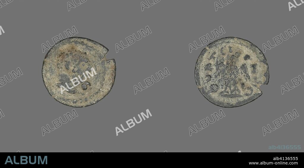 ANCIENT ROMAN. Coin Depicting the Hero Hercules. Roman. Date: 211 AD-222 AD. Dimensions: Diam. 1.6 cm; 1.53 g. Bronze. Origin: Roman Empire.