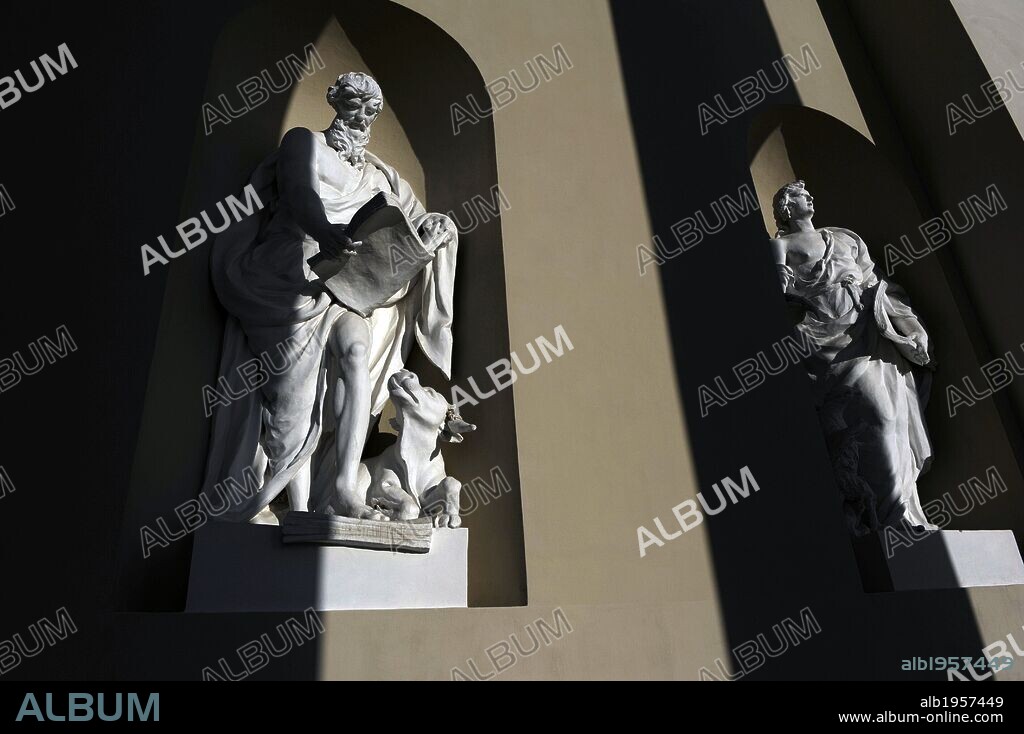 Saint John the Evangelist and Saint Luke the Evangelist with the tetramorph. Sculptures. Facade of the Cathedral of Vilnius. By Tommaso Righi (1727-1802). 1783. Lithuania.