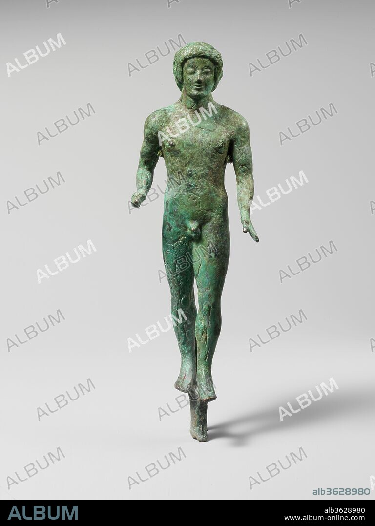 Bronze statuette of a nude youth. Culture: Etruscan. Dimensions: H.: 6 13/16 in. (17.3 cm). Date: ca. 480-470 B.C..
The stance, nudity, and hairstyle of this fine bronze remind one of large-scale kouroi, the famous commemorative statues of youths set up in Greek sanctuaries and cemeteries. The Etruscan artist focused more attention on the facial details and less on musculature than Greek artists typically did. The figure once held an object in his right hand.