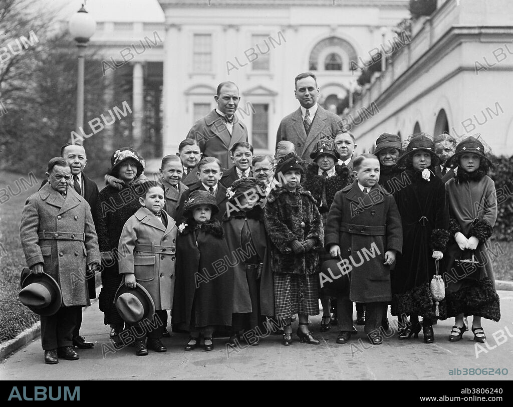 Entitled: "The entire company of the tiny men and women who compose the famous singer midgets were received by President Coolidge. Roland Robbins, manager of B.F. Keith's Theatre accompanied these little people to the White House. They have appeared in almost every country in the world." Singer's Midgets were a popular vaudeville group in the first half of the 20th century. Leopold von Singer (May 3, 1877 - March 5, 1951) formed Singer's Midgets in 1912-13, and built the Liliputstadt, a "midget city" at the "Venice in Vienna" amusement park, where they performed. The Liliputstadt was a major success, Singer began to tour with his performers throughout Europe and, in the process, recruited new members. After WWI broke out, the troupe traveled to the United States, and remained there for the remainder of their existence where they performed in vaudeville theaters. During the 1930s, some of Singer's Midgets began appearing in films, most notably, The Terror of Tiny Town and The Wizard of Oz. The Singer Midgets disbanded in the mid-1940s, with many members returning home to their native Europe. Photographed by Harris & Ewing, April 7, 1924.