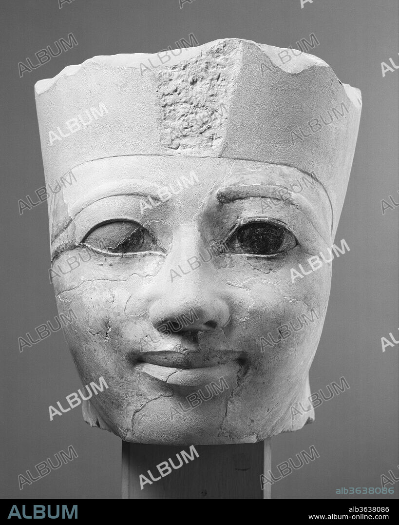 Head of an Osiride Statue of Hatshepsut Originally in the Temple Sanctuary SE Corner. Dimensions: 22 cm (8 11/16 in), 25.8 kg (56.8 lb.). Dynasty: Dynasty 18. Reign: Joint reign of Hatshepsut and Thutmose III. Date: ca. 1479-1458 B.C..
This head is one of three in the Museum's collection that belong to four Osiride figures of Hatshepsut that decorated the sanctuary of Amun in her funerary temple at Deir el Bahri. The head wears the White Crown of Upper Egypt and was originally at the southern end of the sanctuary. Another head (31.3.153) wears the Double Crown and came from the northern end. Like all the architectural limestone sculptures in Hatshepsut's temple, the sanctuary Osiride statues were painted, but they are distinguished by the unusual light pink pigment used for their flesh tone.