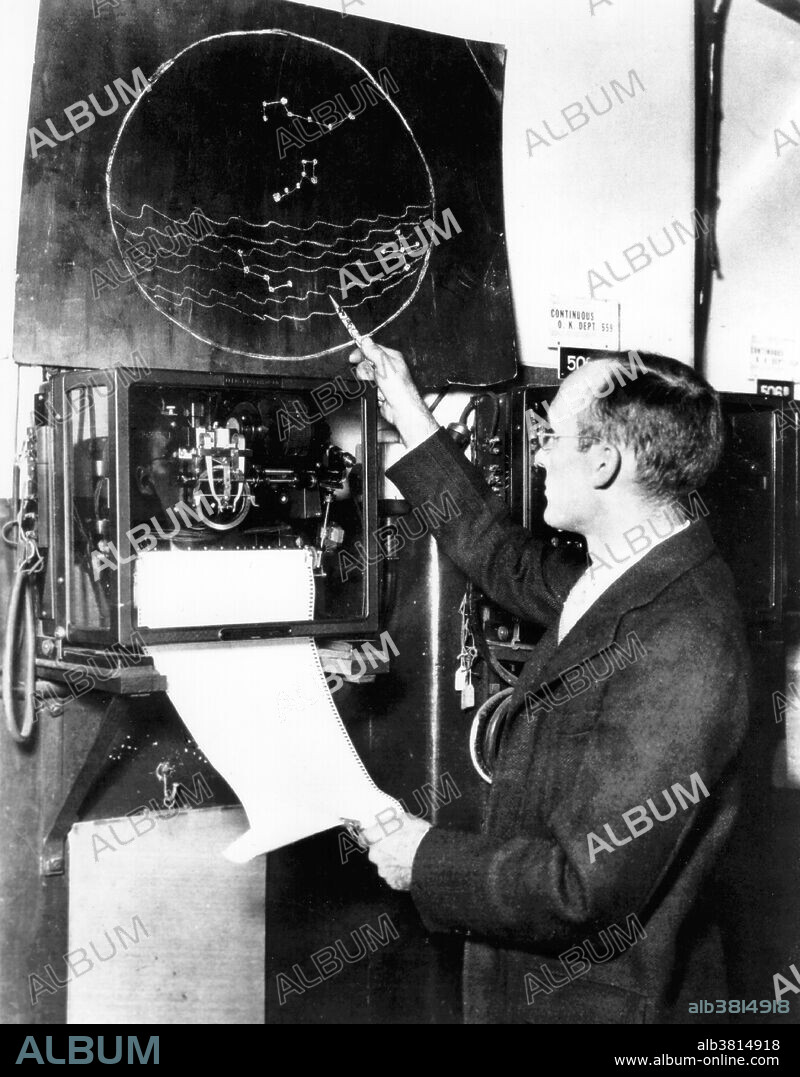 Jansky, working at Bell Telephone Laboratories. Karl Guthe Jansky (October 22, 1905 - February 14, 1950) was an American physicist and radio engineer who in August 1931 first discovered radio waves emanating from the Milky Way. He is considered one of the founding figures of radio astronomy. At Bell Telephone Laboratories in Holmdel, New Jersey, Jansky built an antenna designed to receive radio waves at a frequency of 20.5 MHz. It was mounted on a turntable that allowed it to be rotated in any direction, earning it the name "Jansky's merry-go-round". It had a diameter of approximately 100 ft. and stood 20 ft. tall. By rotating the antenna on a set of four Ford Model-T tires, the direction of a received signal could be pinpointed. A small shed to the side of the antenna housed an analog pen-and-paper recording system. Bell Labs, however, rejected his request for funding on the grounds that the detected emission would not significantly affect their planned transatlantic communications system. Jansky was re-assigned to another project and did no further work in the field of astronomy. He died at age 44 due to a heart condition. In honor of Jansky, the unit used by radio astronomers for the strength (or flux density) of radio sources is the jansky. The crater Jansky on the Moon is also named after him. Undated, no photographer credited.