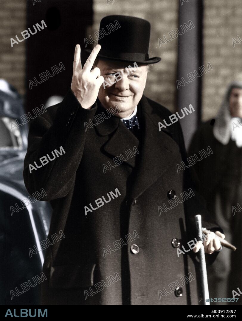 Winston Churchill making his famous V for Victory sign, 1942. A typical gesture of defiance from Britain's wartime Prime Minister. (Colorised black and white print).