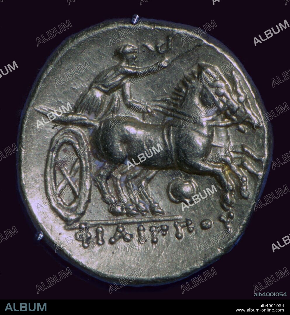 The coin refers to Phillip's success in a chariot race in the Olympic Games of 356 BC. Many of these coins were used to pay western 'barbarian' mercenaries, and formed the basis for the design of many Celtic coins.