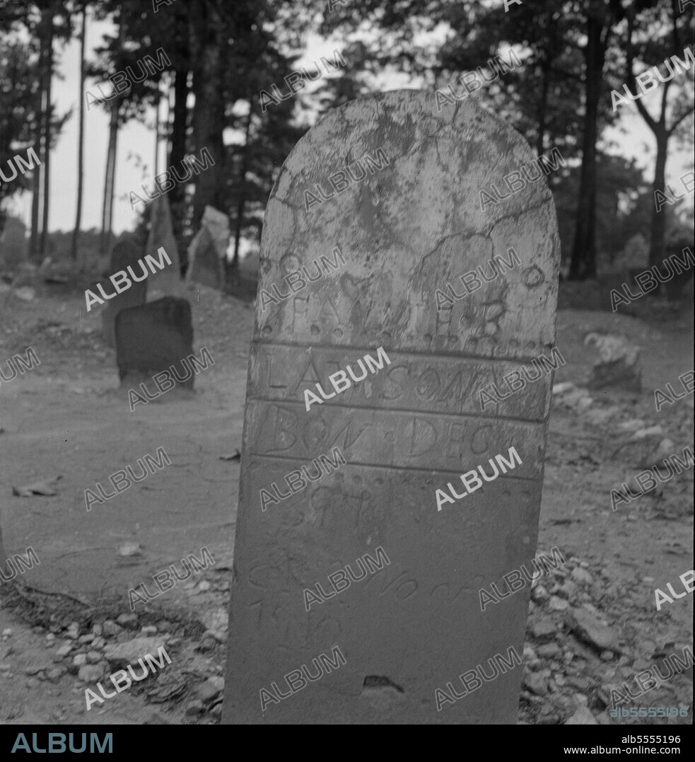 DOROTHEA LANGE. Tombstone in a red clay Negro cemetery. Person County, North Carolina.