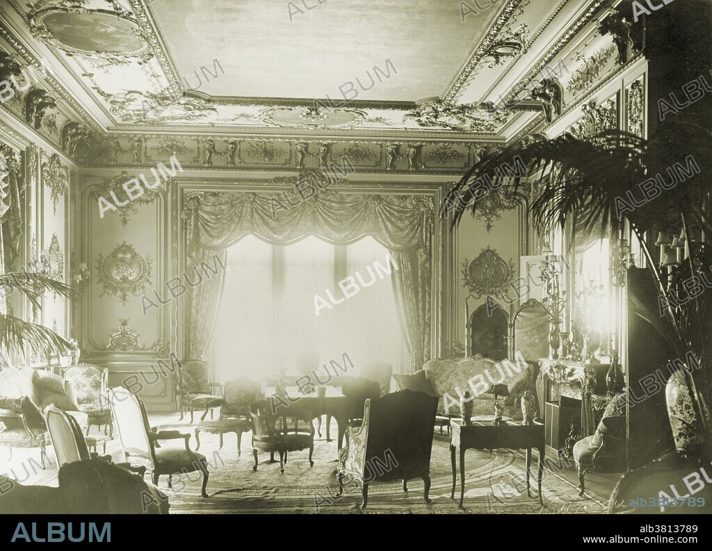 Interior of John Jacob Astor IV's house on Fifth Avenue in New York City, 1912. Astor (1864-1912) was an American businessman, real estate builder, investor, and a prominent member of the Astor family. He died in the sinking of the RMS Titanic during the early hours of April 15. He was among the 1,514 people on board who did not survive. He was the richest passenger aboard the Titanic and was thought to be among the richest people in the world at that time, with a net worth of nearly $87 million when he died.