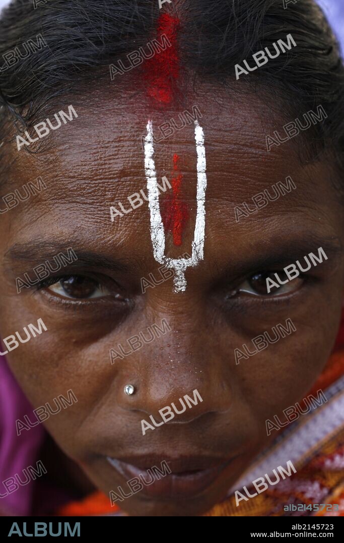 Hindu woman wearing the trident-shaped mark worn by the votaries of Vishnu.