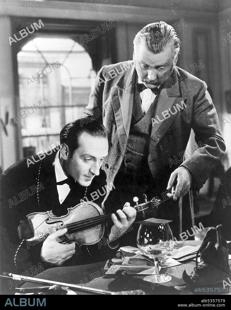 BASIL RATHBONE and NIGEL BRUCE in THE ADVENTURES OF SHERLOCK