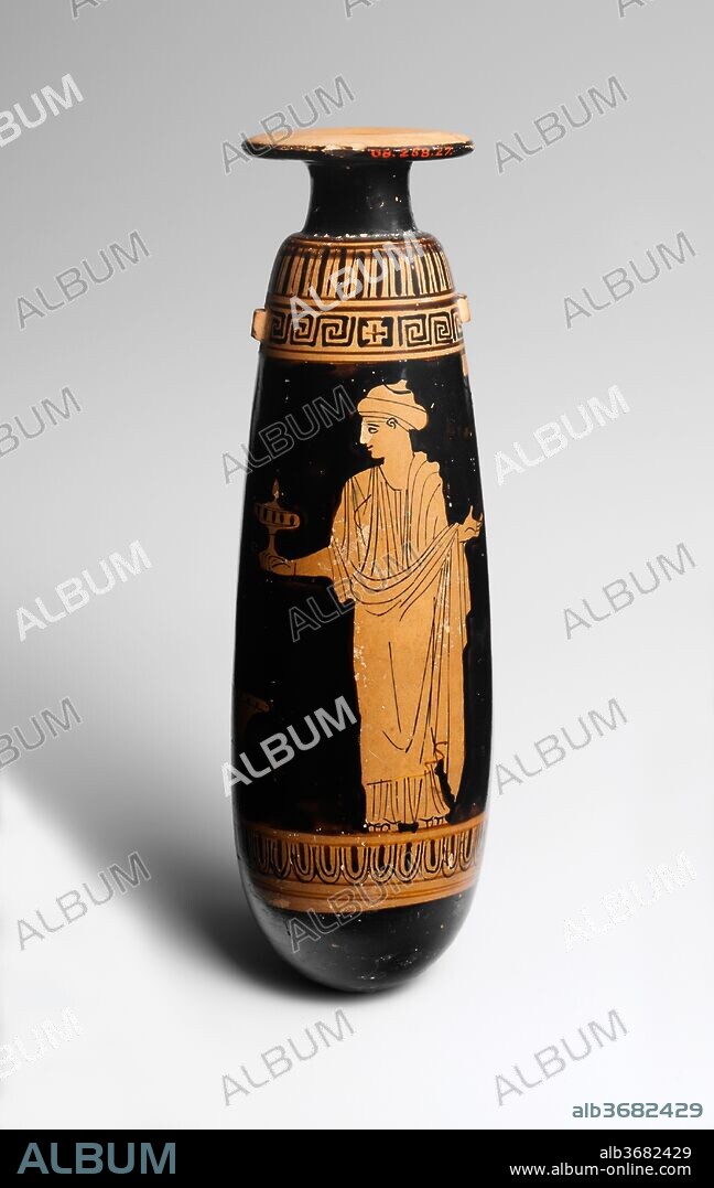 Terracotta alabastron (perfume vase). Culture: Greek, Attic. Dimensions: H. 6 13/16 in. (17.3 cm)
diameter  2 in. (5.1 cm). Date: ca. 440 B.C..
Obverse, woman with mirror
Reverse, woman with plemochoe (perfume vase)
The column indicates that the scene is set indoors, and the kalathos (wool basket) on the ground suggests the ladies' occupation. The representation of each figure is noteworthy. The one with the mirror wears a peplos and her hair is bound with fillets. She appears younger. The other is dressed in a chiton and himation with her hair in a sakkos (snood). The Persephone Painter, whose masterpiece is displayed in the Jaharis Gallery on the main floor, characterizes figures with utmost economy.