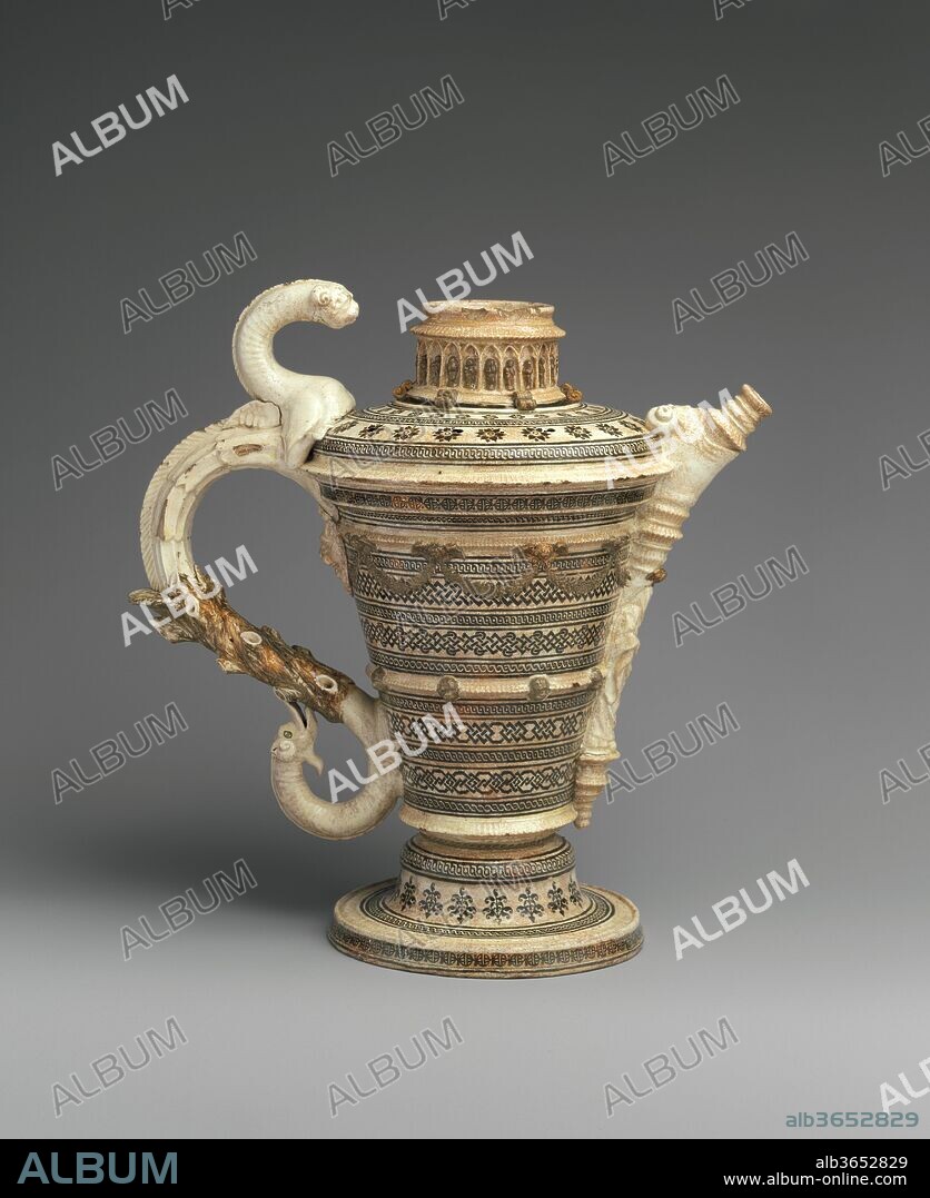 Ewer. Culture: French, Saint-Porchaire or Paris. Dimensions: Height: 10 5/16 in. (26.2 cm). Date: ca. 1550.
This ewer is one of the largest and most impressive examples of a low-fire white pottery made in France in the middle years of the sixteenth century. Known as Saint-Porchaire ware, this group of elaborate and often architectural pieces is distinguished by the complex interlace designs of colored clays inlaid into the cream-colored earthenware body. These wares were believed to have been produced in the town of Saint-Porchaire in western France, but a Paris origin has also been suggested due to their technical sophistication and the ambition of their designs.
[Jeffrey H. Munger, 2011].