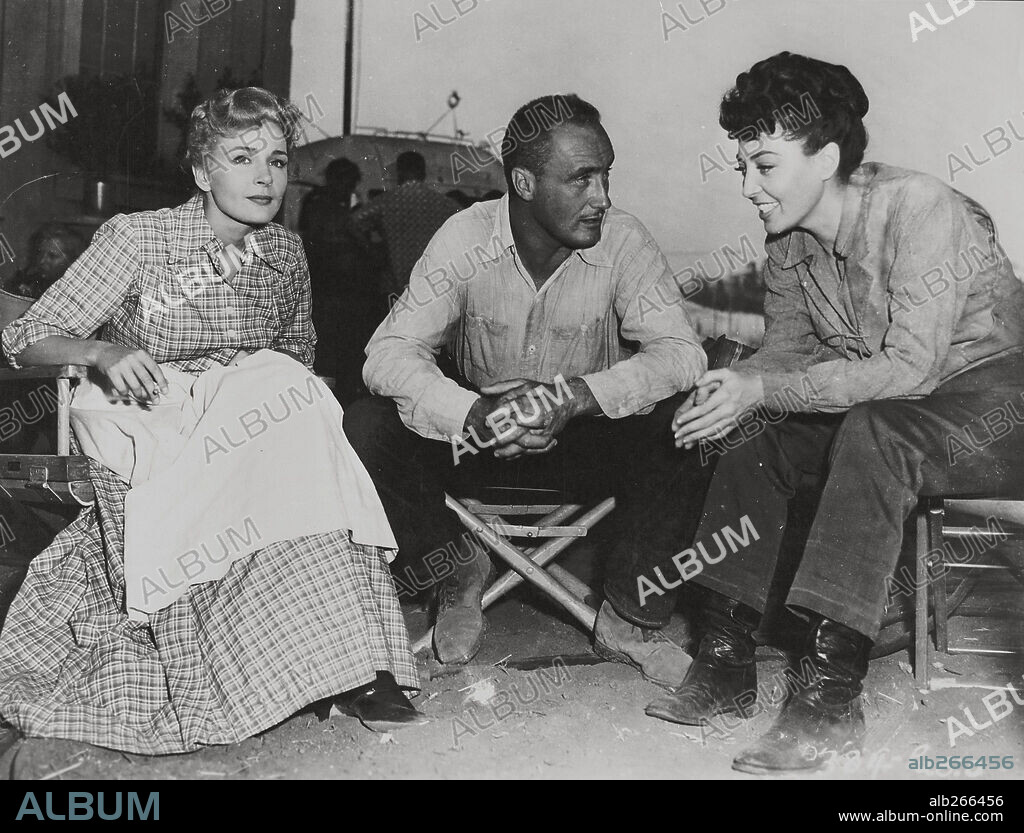 ANDRE DE TOTH and DOLORES DORN in THE BOUNTY HUNTER, 1954, directed by ANDRE DE TOTH.